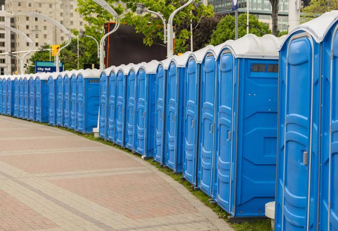 a line of portable restrooms at an outdoor wedding, catering to guests with style and comfort in Colton, CA